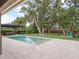 Gorgeous backyard with pool, pergola, large trees, and plenty of green space at 1265 Estancia Woods Loop, Windermere, FL 34786