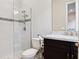 The bathroom offers a tile shower and dark cabinets with a marble countertop sink at 1265 Estancia Woods Loop, Windermere, FL 34786