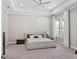 Comfortable bedroom with a platform bed, soft carpeting, and neutral decor at 1265 Estancia Woods Loop, Windermere, FL 34786