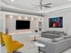 Cozy living room with ceiling fan, comfortable sofas, modern decor, and recessed lighting at 1265 Estancia Woods Loop, Windermere, FL 34786