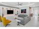 Open living room with decorative wall unit, recessed lighting, ceiling fan, and comfortable seating at 1265 Estancia Woods Loop, Windermere, FL 34786