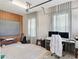 A home office features a projector, screen, and rug over a tile floor at 1265 Estancia Woods Loop, Windermere, FL 34786