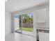 A large glass door leads to a patio and fenced backyard, offering great natural light at 1267 Stockwell Ave, St Cloud, FL 34771