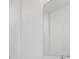 Bathroom view showcasing a large mirror and white tiling around the shower at 1267 Stockwell Ave, St Cloud, FL 34771