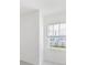 Bright bedroom featuring a large window with views of the neighborhood at 1267 Stockwell Ave, St Cloud, FL 34771
