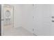 Hallway view to bathroom featuring a pedestal sink and toilet at 1267 Stockwell Ave, St Cloud, FL 34771
