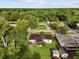 Aerial view of the home with a backyard and wooded area in the background at 137 W Lauren Ct, Fern Park, FL 32730