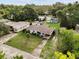 An aerial view of a single-Gathering home with a driveway, lawn, and mature trees at 137 W Lauren Ct, Fern Park, FL 32730