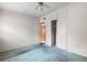 This empty bedroom features a ceiling fan, closet, and attached door at 137 W Lauren Ct, Fern Park, FL 32730