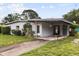 Charming single-story home featuring a covered carport and inviting front yard landscaping at 137 W Lauren Ct, Fern Park, FL 32730