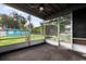 Enclosed and screened in patio space with view of backyard at 137 W Lauren Ct, Fern Park, FL 32730