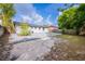 This backyard features a concrete patio, a fenced perimeter and some greenery at 1417 Pine Lake Rd, Orlando, FL 32808