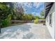 The backyard offers a large concrete patio and a fenced perimeter at 1417 Pine Lake Rd, Orlando, FL 32808