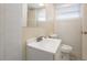 Bathroom featuring a vanity, a toilet and a mirror at 1417 Pine Lake Rd, Orlando, FL 32808