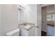 Bathroom with updated granite vanity, tile flooring, and white paint at 1417 Pine Lake Rd, Orlando, FL 32808