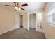 Bedroom showcasing neutral walls, carpet, a ceiling fan and a closet at 1417 Pine Lake Rd, Orlando, FL 32808