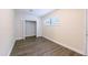 Bright bedroom with vinyl floors, closet, and natural light from a window at 1417 Pine Lake Rd, Orlando, FL 32808