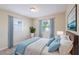 Bedroom featuring carpet, a ceiling fan and 2 windows at 1417 Pine Lake Rd, Orlando, FL 32808