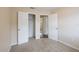 Bedroom features neutral paint and carpet, closet, and base trim at 1417 Pine Lake Rd, Orlando, FL 32808