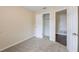 Bedroom features neutral paint and carpet, closet, and base trim at 1417 Pine Lake Rd, Orlando, FL 32808