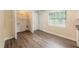 A view of the bedroom closet and vinyl floors, plus an exterior access door at 1417 Pine Lake Rd, Orlando, FL 32808