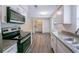 Bright kitchen featuring stainless steel appliances, granite countertops, and luxury vinyl plank flooring at 1417 Pine Lake Rd, Orlando, FL 32808