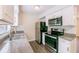 A closer view of kitchen appliances, stone counters and subway tile backsplash at 1417 Pine Lake Rd, Orlando, FL 32808