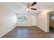 Living room featuring hard wood flooring, ceiling fan, bright paint, and natural light at 1417 Pine Lake Rd, Orlando, FL 32808