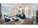 A bright living room features hardwood floors, ceiling fan, and furniture at 1417 Pine Lake Rd, Orlando, FL 32808