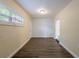 Bright living room features vinyl floors, neutral walls, with exterior access at 1417 Pine Lake Rd, Orlando, FL 32808