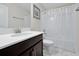 Clean bathroom featuring modern fixtures, quartz countertop, and white-tiled shower at 1521 Flange Dr, Davenport, FL 33896