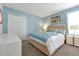 Bedroom with a queen bed, blue walls, closet and dresser at 1521 Flange Dr, Davenport, FL 33896