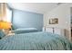 Lovely bedroom with twin beds, soft blue accents, and a bright, airy feel at 1521 Flange Dr, Davenport, FL 33896