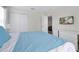 Relaxing bedroom featuring a mounted TV, closet, and contemporary furnishings at 1521 Flange Dr, Davenport, FL 33896