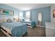 Bedroom with two twin beds and blue decor at 1521 Flange Dr, Davenport, FL 33896
