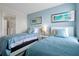 Bedroom with two twin beds and blue decor at 1521 Flange Dr, Davenport, FL 33896
