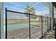 Enclosed pool area, showcasing the safety fence, patio, and expansive backyard at 1521 Flange Dr, Davenport, FL 33896