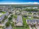 Scenic aerial shot of the community, highlighting the houses and surrounding landscape at 15822 Woodland Spring Ct, Orlando, FL 32828