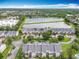 Pictureque aerial view of the community and the nearby pond with water fountain at 15822 Woodland Spring Ct, Orlando, FL 32828