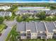 Aerial view showcasing the community's well-maintained landscaping and nearby pond at 15822 Woodland Spring Ct, Orlando, FL 32828