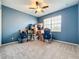 Spacious bedroom with carpet, a ceiling fan and a bright window for ample natural light at 15822 Woodland Spring Ct, Orlando, FL 32828