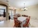 View of the dining room showing access to the kitchen and living room, great for entertaining at 15822 Woodland Spring Ct, Orlando, FL 32828