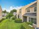 Lush landscaping surrounds this inviting condo, complete with a screened in patio at 15822 Woodland Spring Ct, Orlando, FL 32828