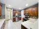 Spacious kitchen with stainless steel refrigerator, tile backsplash, and lots of cabinet space at 15822 Woodland Spring Ct, Orlando, FL 32828