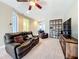 Second floor living room with recliners, shelving, and entertainment center at 15822 Woodland Spring Ct, Orlando, FL 32828