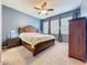 The main bedroom boasts neutral carpet and a large window for great natural light at 15822 Woodland Spring Ct, Orlando, FL 32828