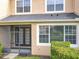 View of the screened patio with stylish doors leading to the home's interior at 15822 Woodland Spring Ct, Orlando, FL 32828