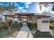 A shaded outdoor structure provides a relaxing community gathering place with lush tropical landscaping at 1624 Little Wren Ln, Winter Park, FL 32792