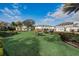 Well-maintained community picnic and grilling area amidst a beautifully landscaped lawn with mature trees at 1624 Little Wren Ln, Winter Park, FL 32792