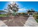 A community playground with modern play equipment, woodchip ground cover, and seating areas for families at 1624 Little Wren Ln, Winter Park, FL 32792